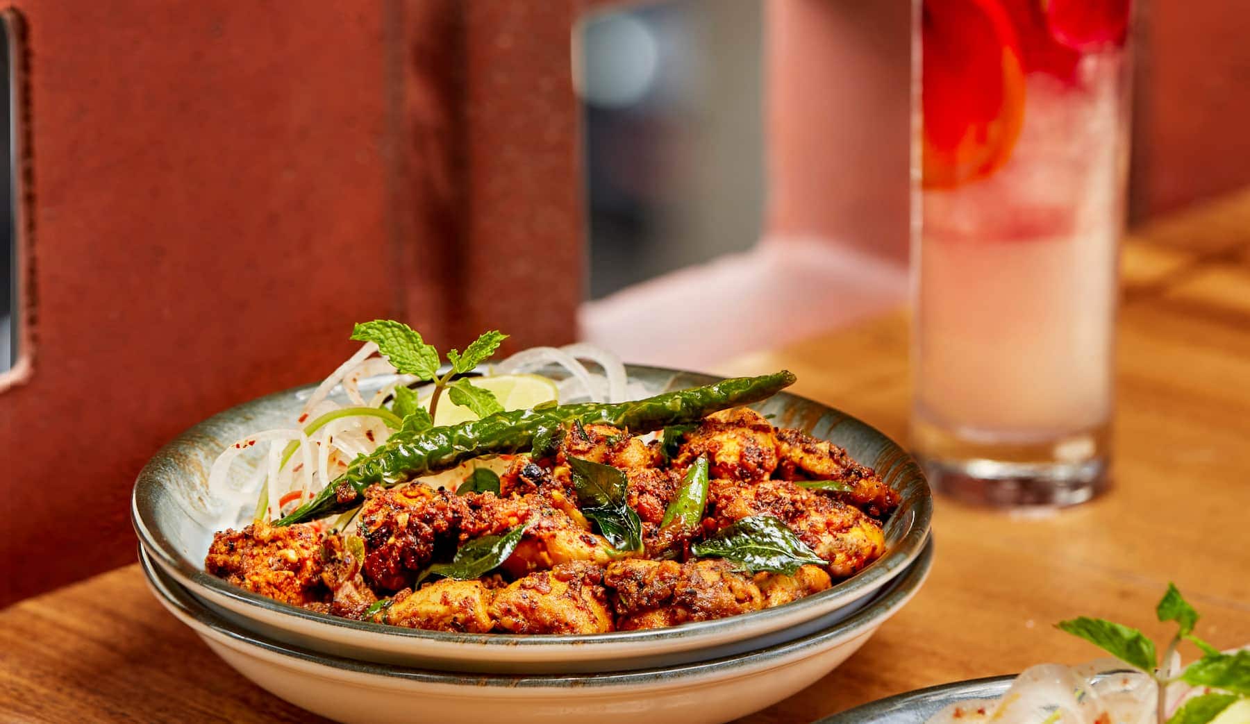 Spiced chicken bowl with curry leaves and a mocktail at Makau