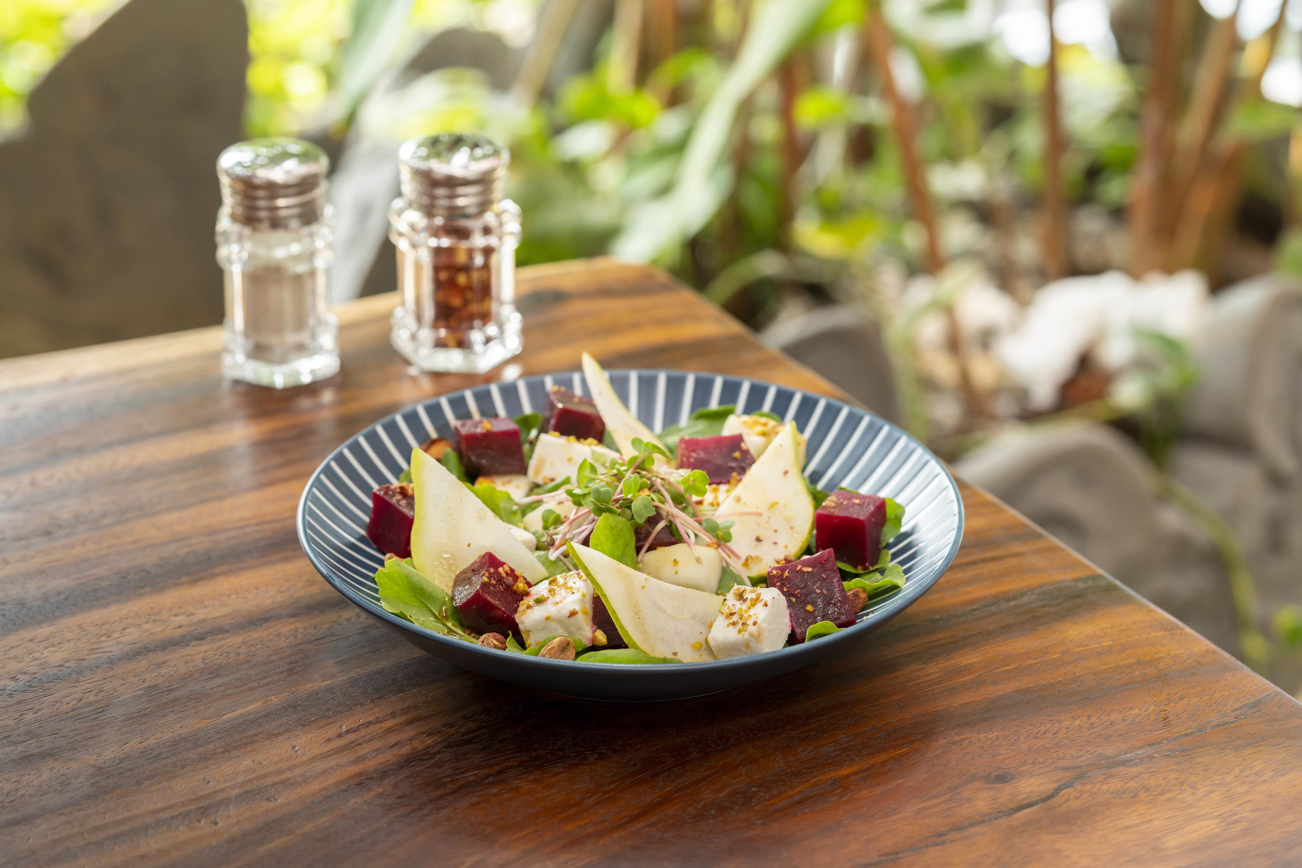 Beetroot, pear and cheese salad bowl at Makau